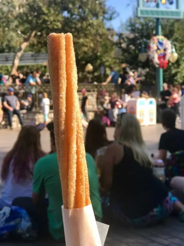 One of the best Disneyland snacks is a Disneyland churro which you can't get at Disney World!