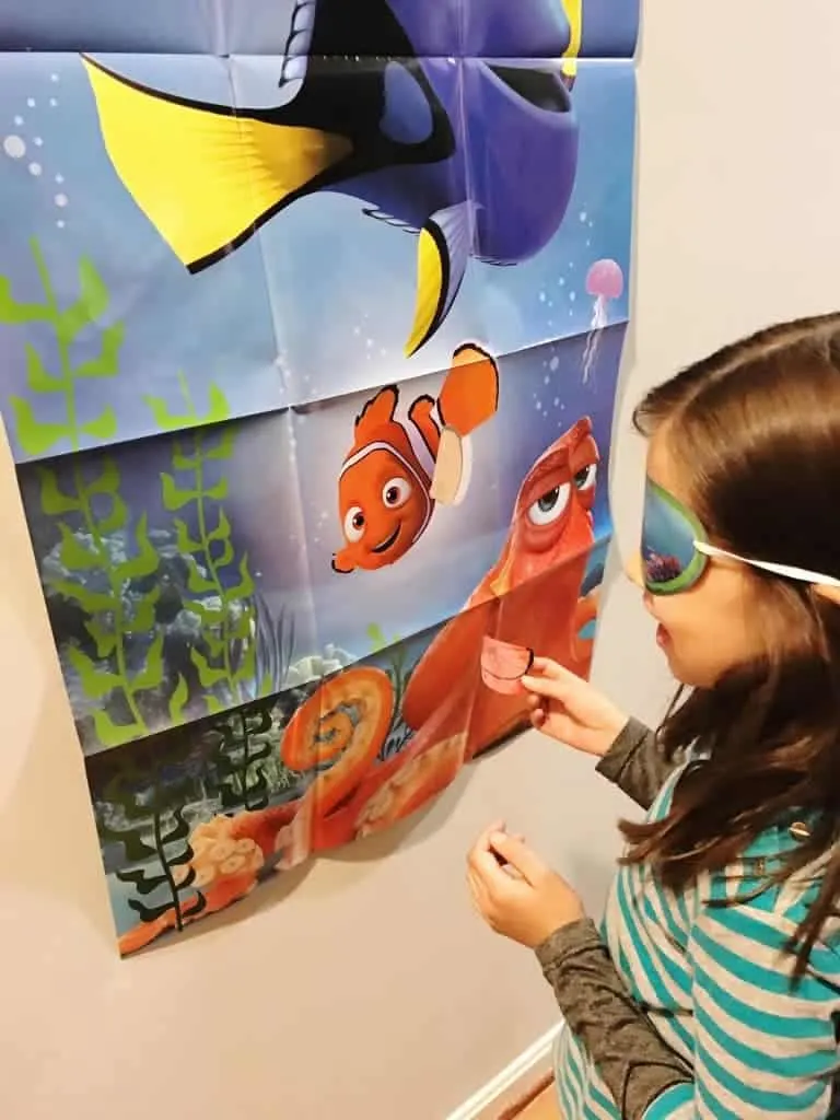 A fun Finding Dory party game is pin-the-fin-on-Nemo.