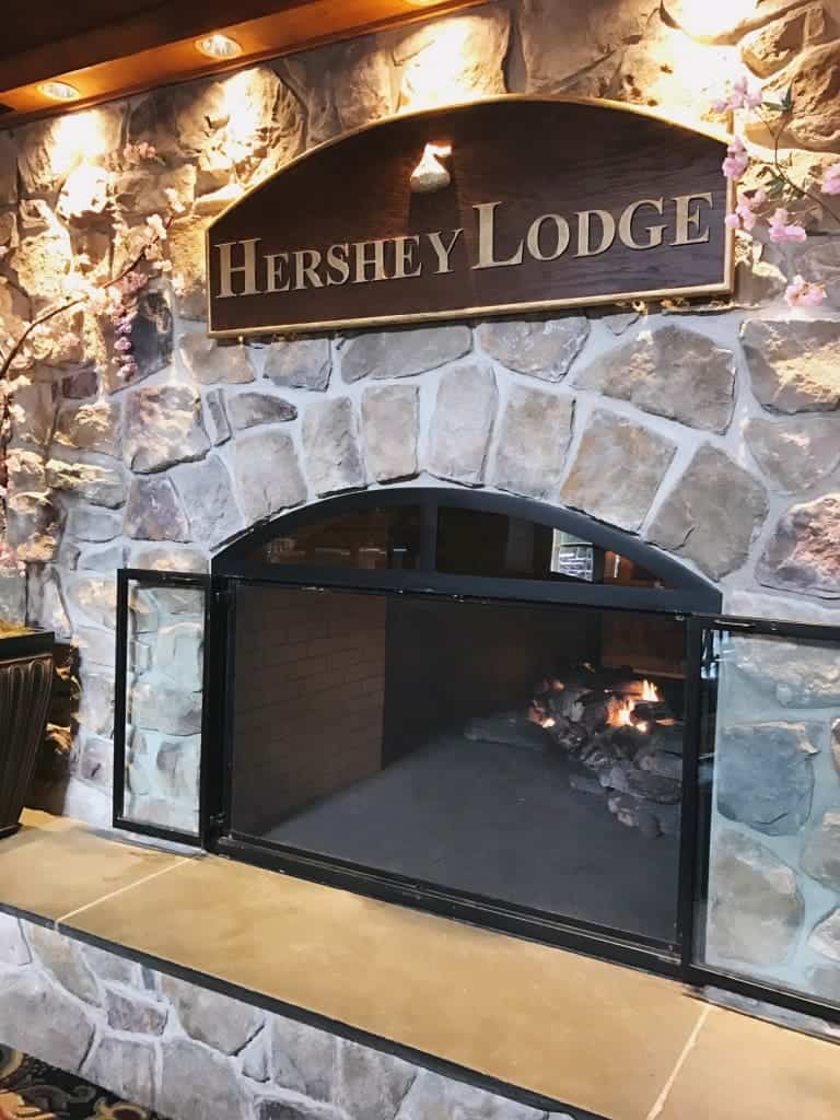 5 Reasons why you should stay at the Hershey Lodge. One of them is the warm fireplace.