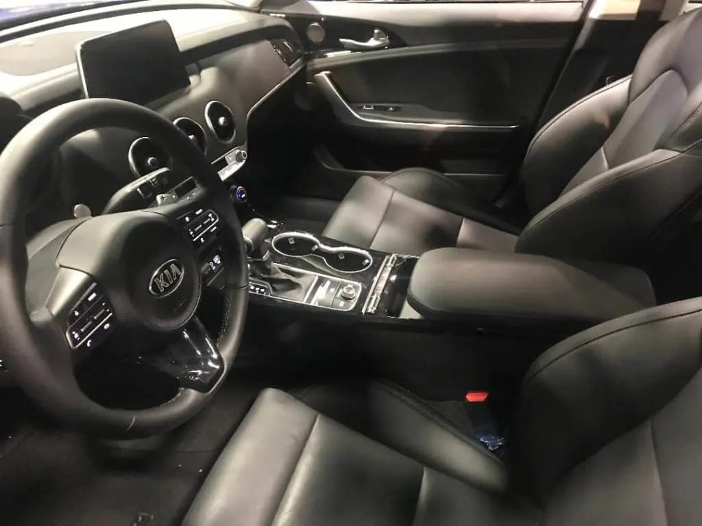 At the Washington Auto Show, sit inside cars and feel the leather.