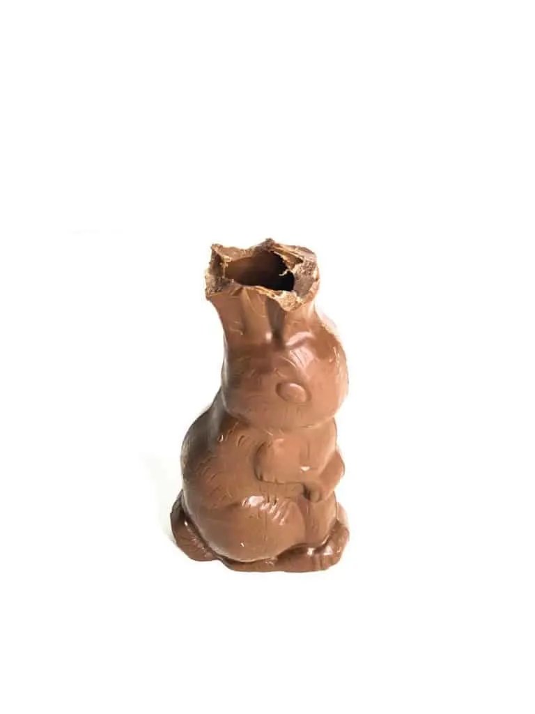 First, bite off the ears of a chocolate bunny when eating it.