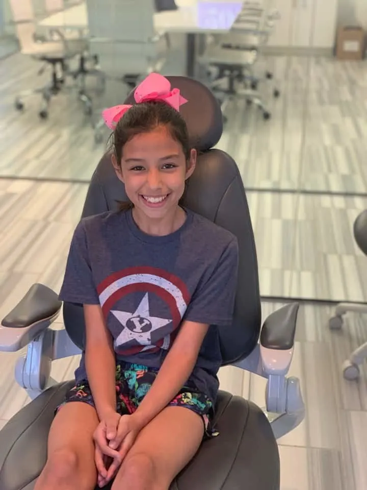 Teen girl receiving Invisalign